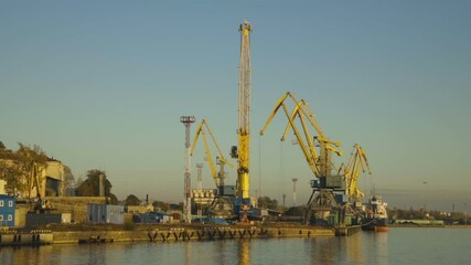 Poster - port with working yellow cranes