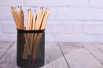 Group of color pencils on table with copy space.