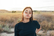 © Cavan Images - Teenager in sportswear and sunglasses at sunset in the countryside