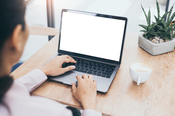 computer mockup blank screen.hand woman work using laptop with white background for advertising,contact business search information on desk at coffee shop.marketing and creative design