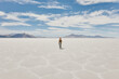 © Cavan Images - Young woman exploring Bonneville Salt Flats during a summer road trip.