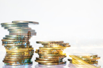 Double exposure of city background and rows of coins. business financial for investment and banking concept.