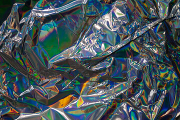Poster - glued colorful holographic background. modern rainbow foil for texture, cover, wallpaper, print, dll