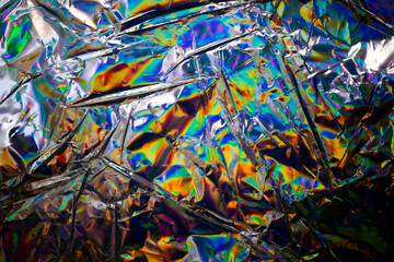 Poster - Glued colorful holographic background. Modern Rainbow foil for Texture, cover, wallpaper, print, dll. Dark futuristic blurred hologram and Abstract gradient colors. 