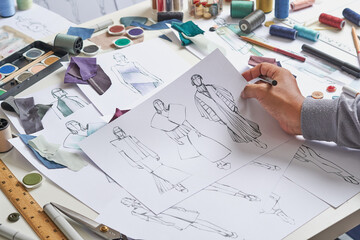 Wall Mural - Fashion designer stylish drawings sketches textile fabric material Costume. Designer creative workshop studio.