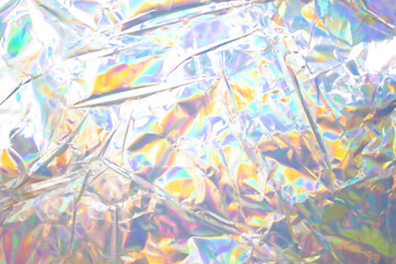 Poster - glued colorful holographic background. modern rainbow foil for texture, cover, wallpaper, print, dll
