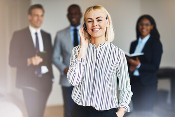 Wall Mural - Smiling businesswoman working in an office