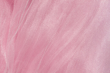 Wall Mural - Pink tulle fabric texture top view. Coral background. Fashion color trends feminine tutu skirt flat lay, female blog backdrop for text signs desidgn. Girly abstract wallpaper, textile surface.