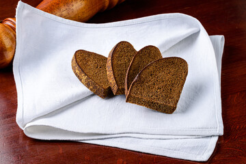 Wall Mural - sliced bread on a white napkin