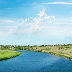 Canvas Print - blue river under light cloudy sky