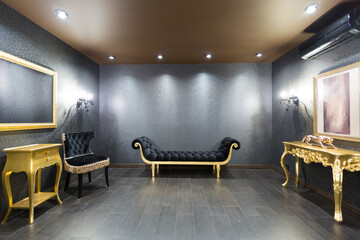 luxurious romantic room in a pompous style in black and gold colors with magnificent furniture