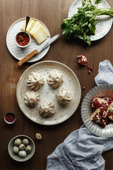 Wall Mural - dishes and snacks of traditional Caucasian Georgian cuisine. classic national serving on a rustic wooden table