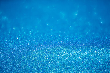 Wall Mural - blue glitter texture christmas abstract background with bokeh