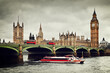 London, the UK. Big Ben, the River Thames, red buses and boat in vintage style