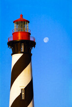 St Augustine Lighthouse Close-up With A Full Moon Against A Blue Sky In The Morning
