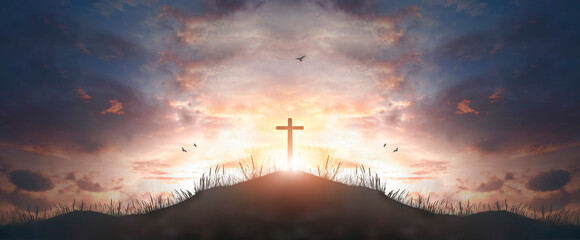 Wall Mural - cross religion symbol silhouette in grass over sunset sky cross religion symbol silhouette in grass 