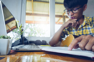 Wall Mural - Young man with glasses sitting worship and learning bible, Online church in home, Home church during quarantine coronavirus Covid-19, Religion concept.