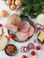 Wall Mural - fresh homemade sausage on a light background with vegetables