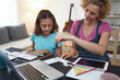 © astrosystem - Child home studying education, homeschooling, with private tutor / mother in the time of viruses, flu and seasonal pandemic.