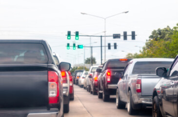 blurred car traffic jam on the road urban, busy cars driving in hour traffic jam