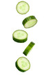 Falling cucumber slices isolated on a white background with clipping path. Flying vegetables