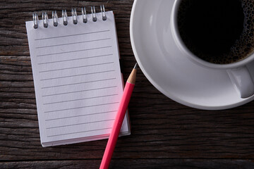 Wall Mural - top view of coffee drink and small note book and pencil