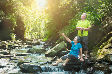 Sticker - happy Senior couple hiking in the nature park