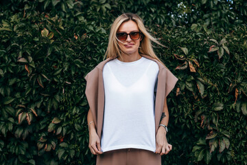 Stylish blonde girl wearing white t-shirt and glasses