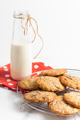 Wall Mural - oatmeal cookies and a glass bottle of milk