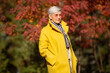 adult woman in pink sunglasses in the park in autumn