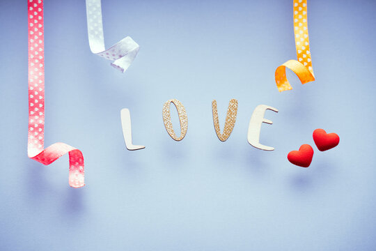 The word love on minimal pastel greeting card, frame, banner. Happy Valentines Day