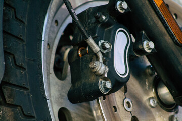 Canvas Print - Closeup of a motorcycle parked in the streets of the city center of the metropolitan area
