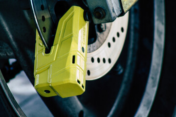 Closeup of a motorcycle parked in the streets of the city center of the metropolitan area
