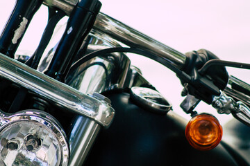 Closeup of a motorcycle parked in the streets of the city center of the metropolitan area
