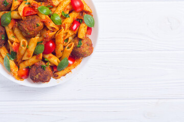 Canvas Print - Italian penne pasta with meatballs and tomatoes