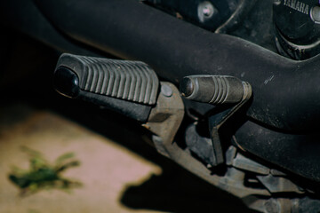 Wall Mural - Closeup of a motorcycle parked in the streets of the city center of the metropolitan area
