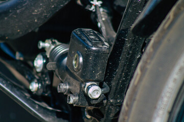 Wall Mural - Closeup of a motorcycle parked in the streets of the city center of the metropolitan area
