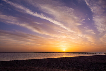  sunset or sunrise 
with a beautiful sky with clouds  on a deserted tropical beach