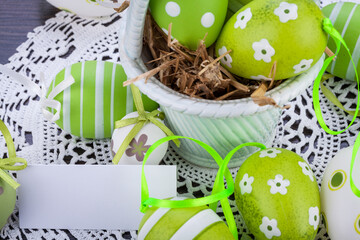 Canvas Print - Colourful green Easter eggs in straw