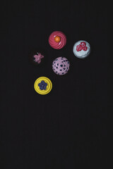 Poster - A set of toy cakes on a dark background.
