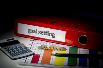 Goal setting on red business binder 