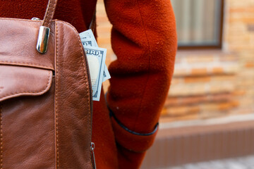 money in bag pocket risk to be stolen on street