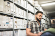 © Antonio Recena - Man works in archive and reviews the different files