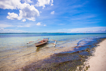 Sticker - Small Fishing boat on the white tropical beach