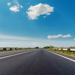 Poster - asphalt road to horizon under blue cloudy sky