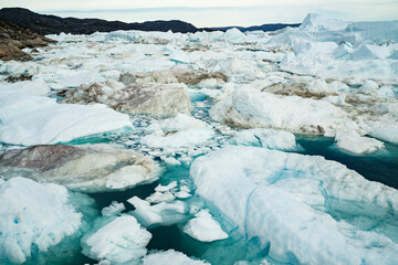 Wall Mural - climate change. iceberg afrom glacier in arctic nature landscape on greenland. icebergs in ilulissat