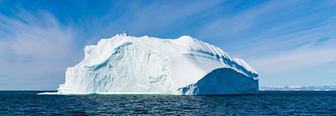 Wall Mural - global warming and climate change concept. arctic icebergs in greenland.