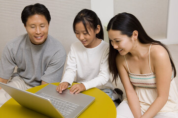 Family Using Laptop