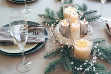 Beautiful table setting with candles for Christmas dinner