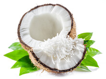 Cracked Coconut Fruit With White Flesh And Shredded Coconut Flakes Isolated On White Background.